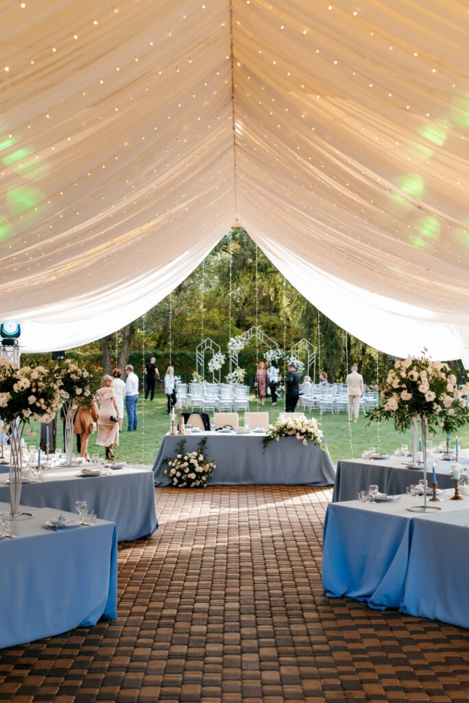 banquet hall tent with blue tablecloths decorations scaled 1 1 Home